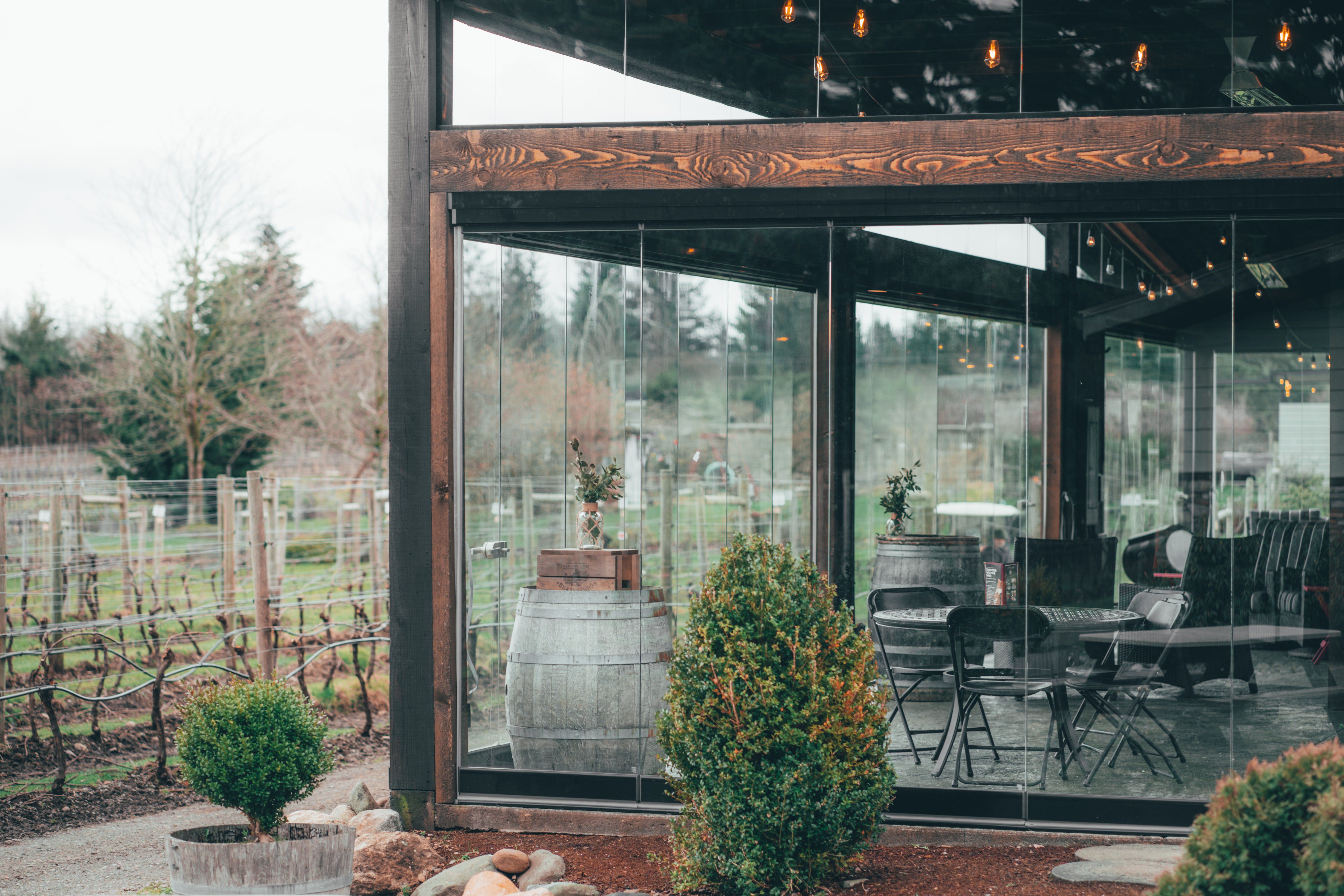 Glass sunroom enclosure for a patio at a winery