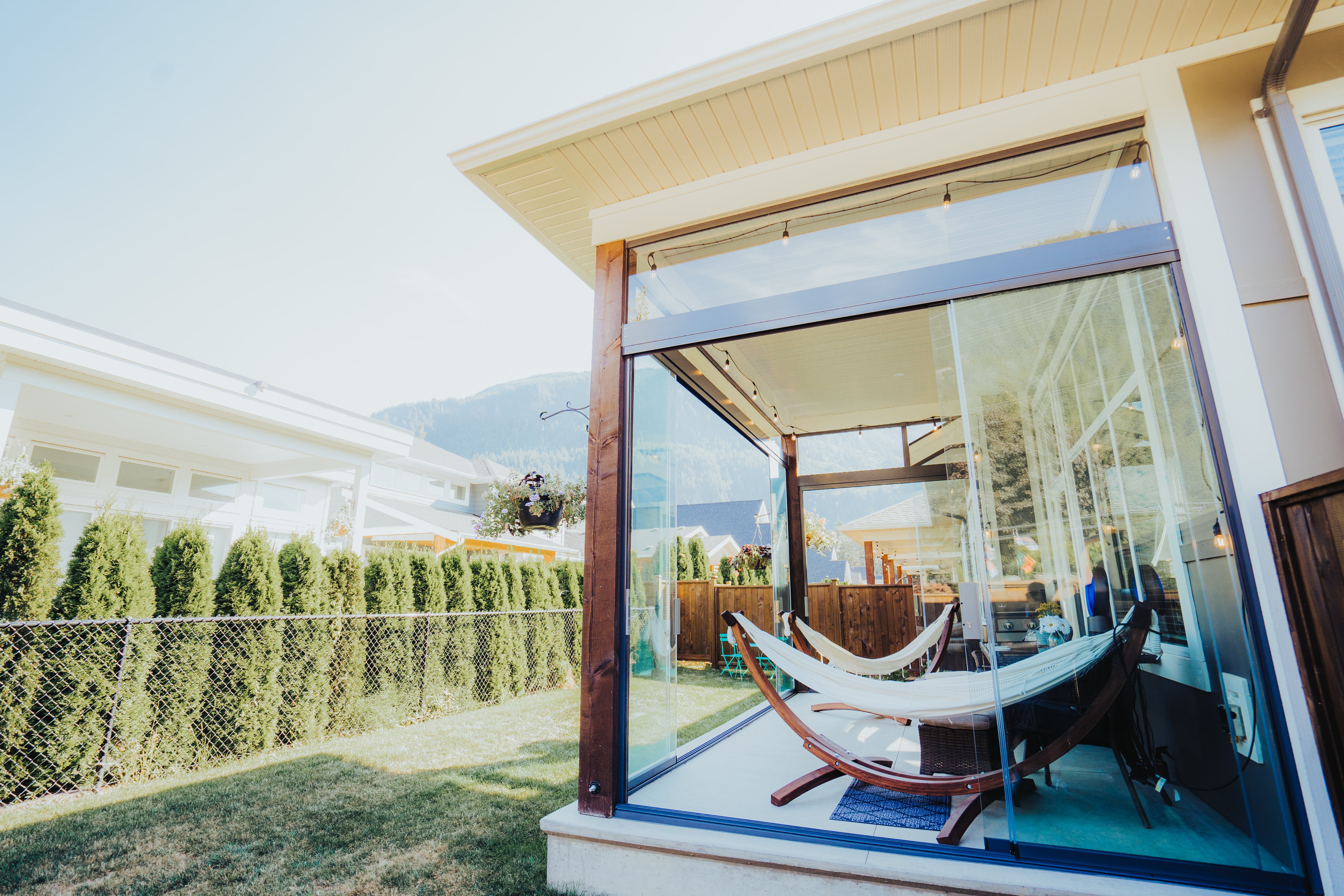 Backyard sunroom with sliding glass wall