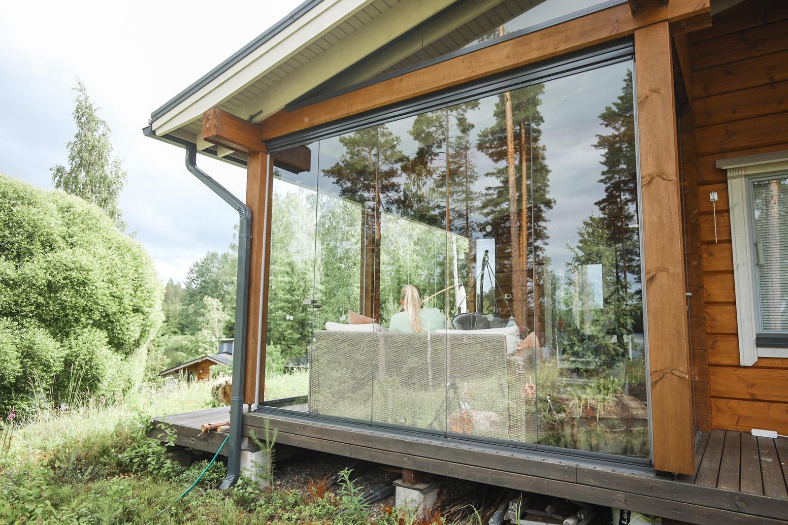 Glazed outdoor space at a summer cottage pictured from the outside