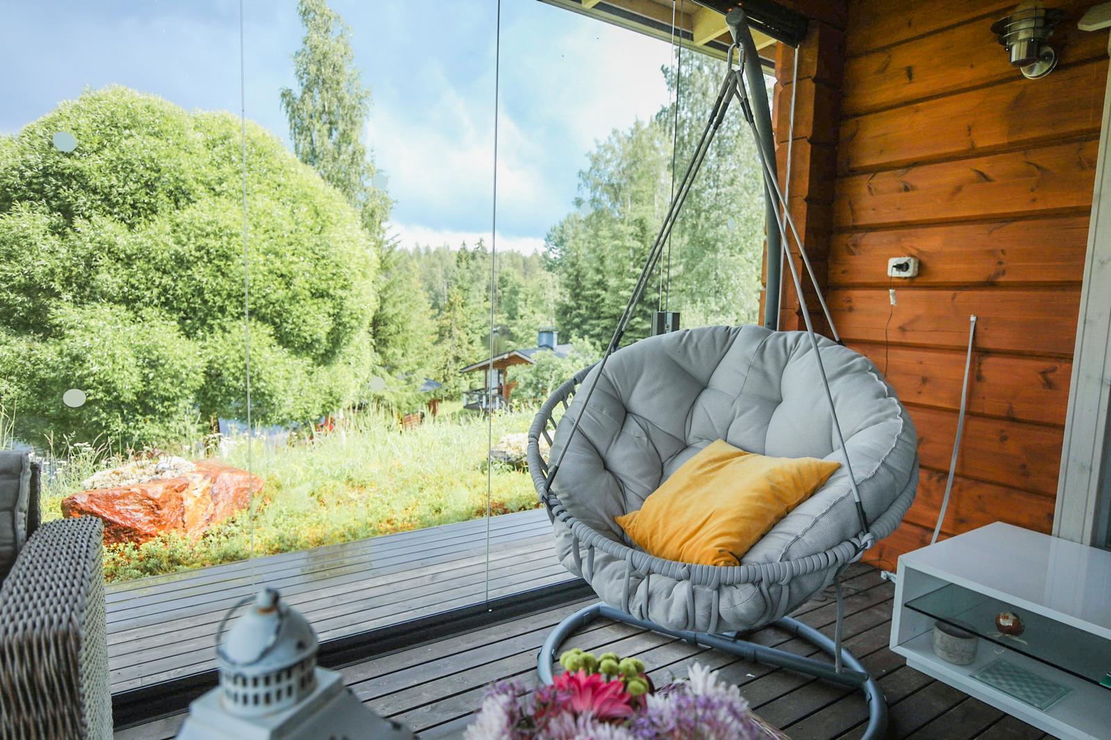 Outdoor living trends: backyard with retractable glass doors overlooking nature scenery